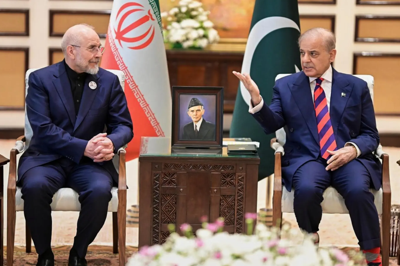 Iran’s Parliament Speaker Mohammad Bagher Ghalibaf, left, meets with hand with Pakistani Prime Minister Shehbaz Sharif, in Islamabad, Pakistan, Saturday, April 11, 2026. (Pakistan Prime Minister Office).png